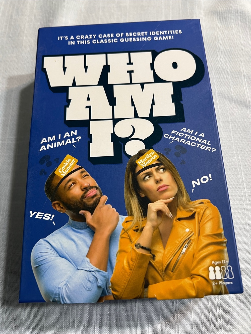 Who Am I? Party Guessing Game - Blue Box with Yellow Accents